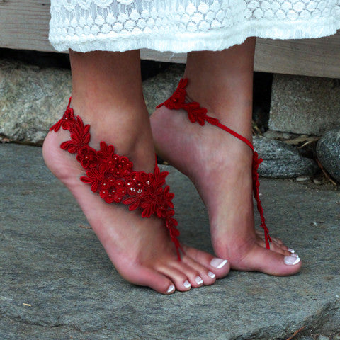 Woman wearing red barefoot lace sandals by Sister Lace 